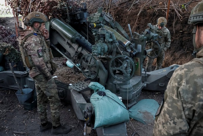 Ukrainian servicement prepare a M777 howitzer to fire towards Russian troops in Donetsk region