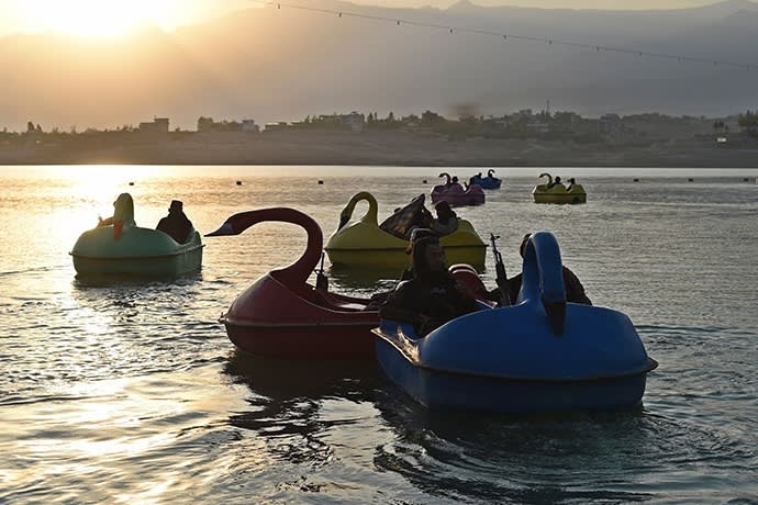 Taliban fighters ride the pedalboats at Qargah. 