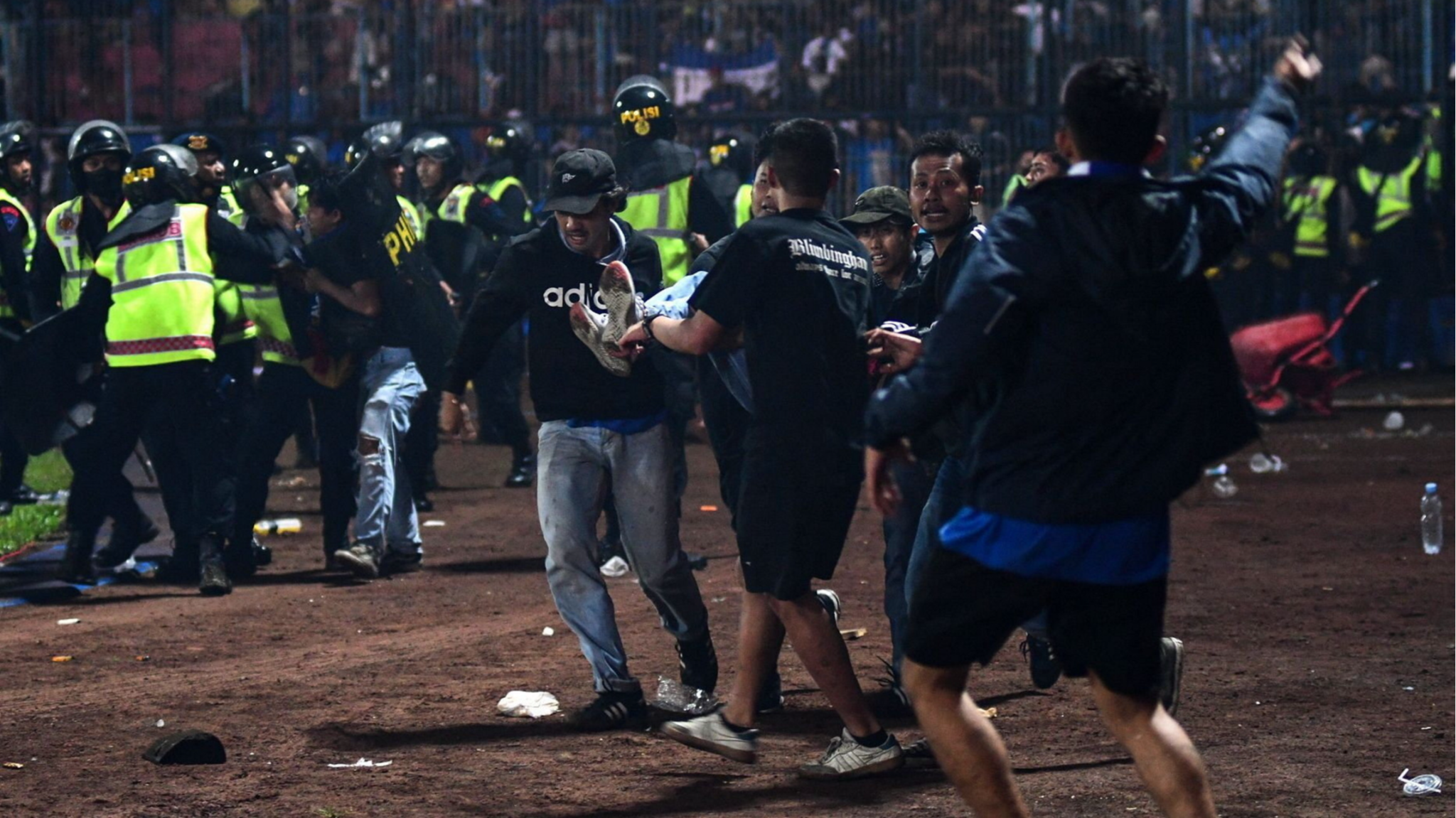 Riot and stampede at Indonesian football match kills 125