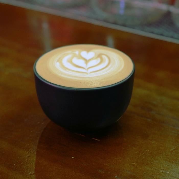 The flat white here is one of the best the author has enjoyed in the city-state