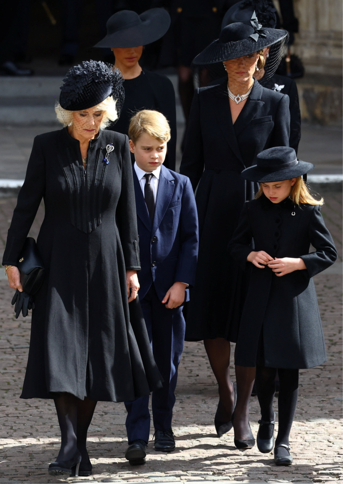 Camilla, the Queen Consort, with Princess Charlotte and Catherine, Princess of Wales, all dressed in black — but with Prince George in navy blue — at Queen’s state funeral