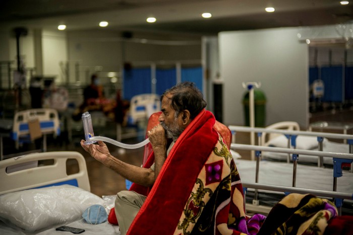 A Covid-19 patient performs a breathing exercise at a hospital in Noida, near Delhi