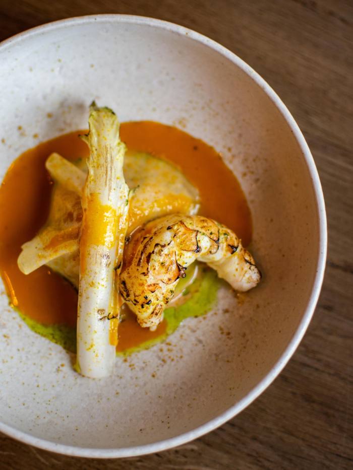 Scorched langoustine tail with laksa sauce and kohlrabi at Restaurant Vermeer
