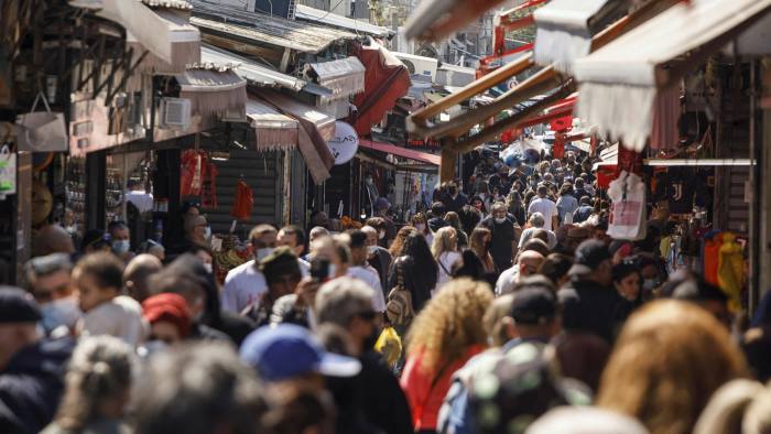 Crowds at Carmel market Tel Aviv last week. Israelis have been celebrating a post-pandemic rebirth since restrictions were eased