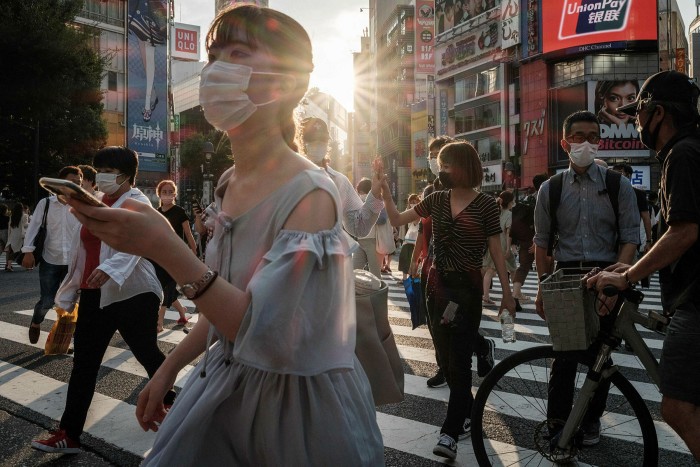 People wear face masks in Tokyo