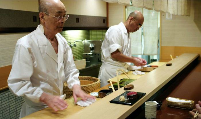 Sushi chef Jiro Ono – seen here at work with his son Yoshikazu – and his famed Tokyo restaurant are the subject of a 2011 documentary