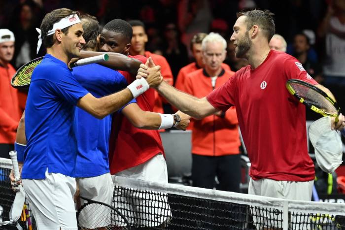 Roger Federer, left, and his doubles partner Rafael Nadal of Team Europe congratulate Jack Sock and Frances Tiafoe of Team World after their Laver Cup loss