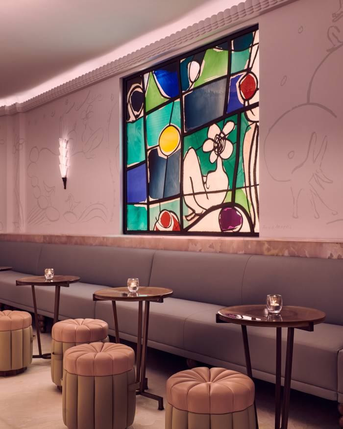 The stained glass window based on an artwork by Annie Morris in the Bar Painter's Room at Claridge's, London