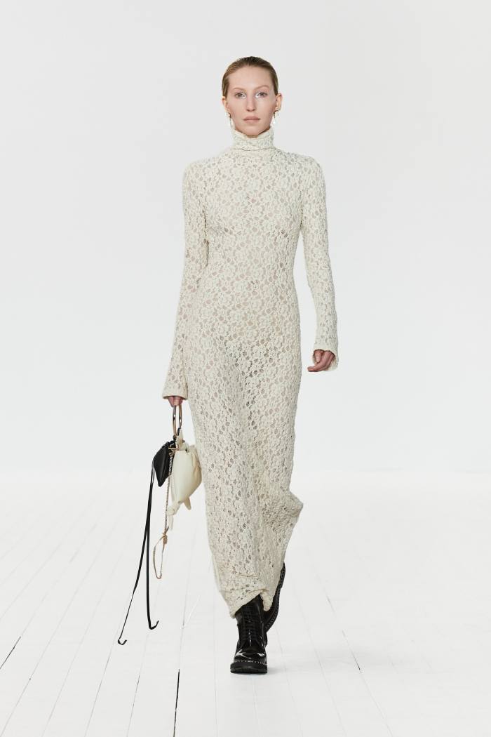 Model in long lacy white dress