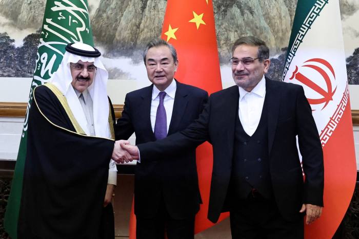 Chinese Communist party member Wang Yi with senior officials from Saudi Arabia and Iran