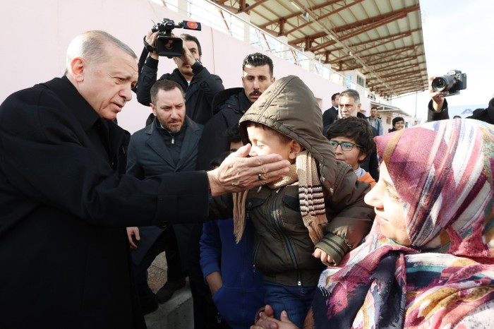 Recep Tayyip Erdoğan greets a child in Adıyaman