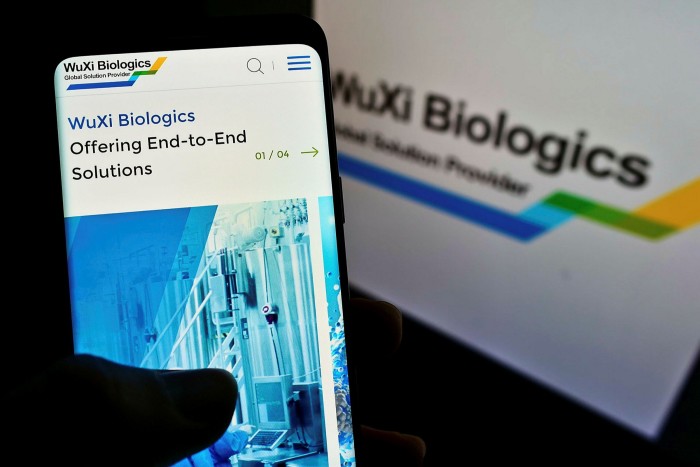 A smartphone showing the webpage of biotechnology company WuXi Biologics 