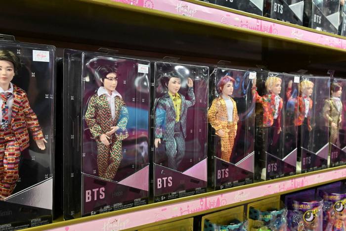Merchandise for boy band BTS on display at Hamleys toy store in London
