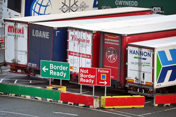 Signs at the port of Holyhead, Wales, reflecting the paperwork now required for lorries going to Ireland. HM Revenue & Customs puts the annual cost to business of filling in 215 million import and export forms at £7.5bn 