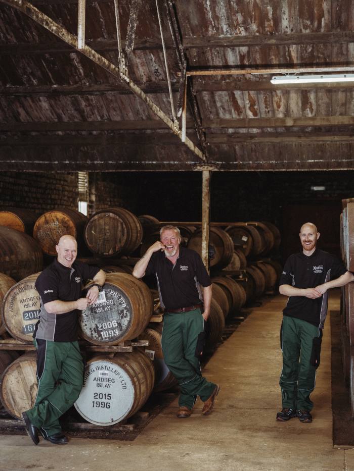 Workers at the Ardbeg distillery on Islay