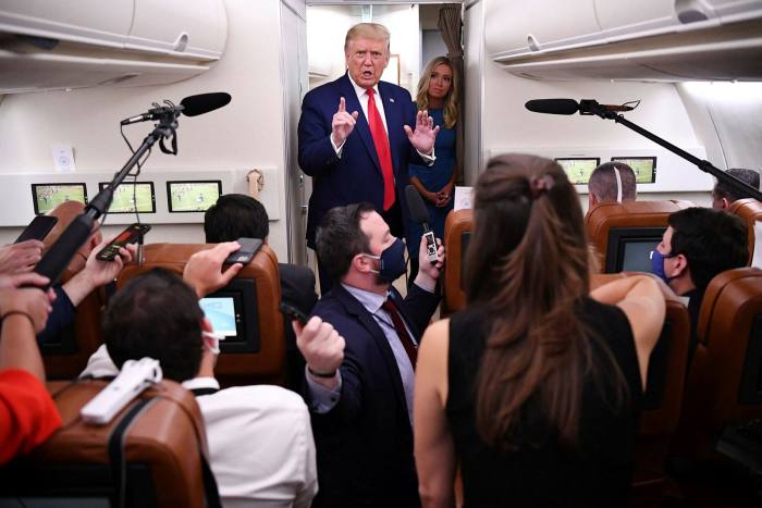 Donald Trump speaks to reporters on Air Force One. The president's announcement on an earlier flight that TikTok needed to be banned came as a complete surprise to his aides