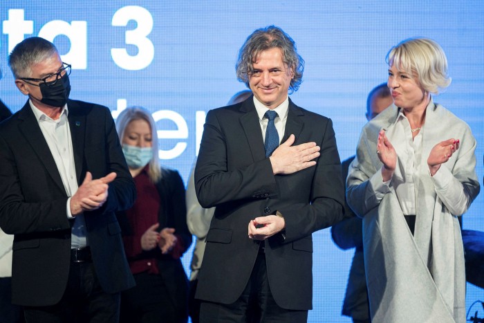 Robert Golob reacts on stage during the pre-election conference in Ljubljana 