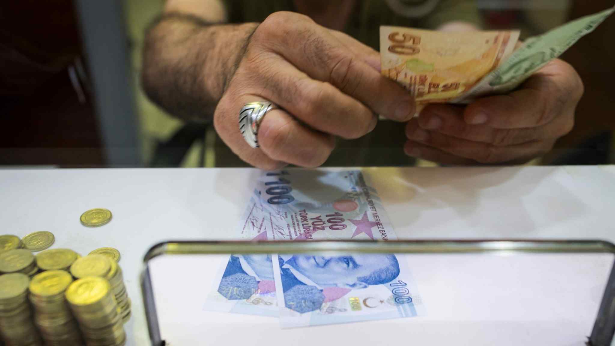 Turkish lira slumps as new economic team starts ‘intentional devaluation’  