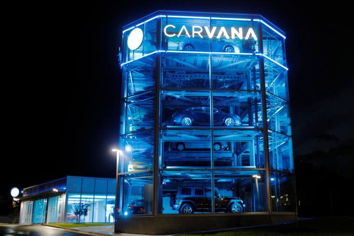 Vehicles are displayed at a Carvana dealership