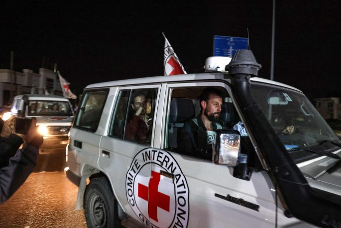 An International Red Cross vehicle carrying a hostage released by Hamas drives towards the Rafah border point with Egypt on Sunday