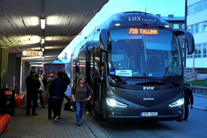 People leave the Lux Express bus from St Petersburg at the Tallinn Bus Station in Tallinn, Estonia