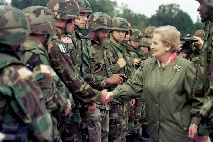 Madeleine Albright shakes hands with American soldiers during a visit to a US airbase in Bosnia in 1998