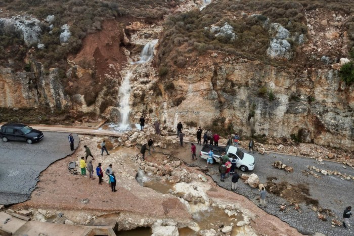 People were left stranded on a road in Shahhat, in the country’s north-east