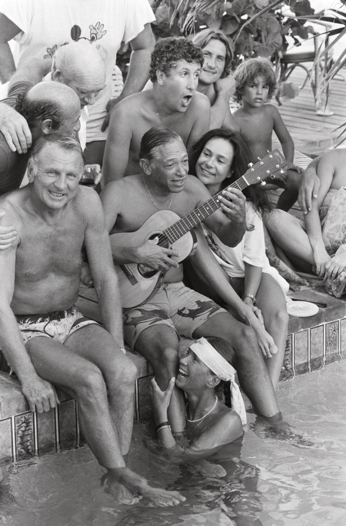 French singer Henri Salvador (with guitar) and his friends wintering in St Barths in January 1981