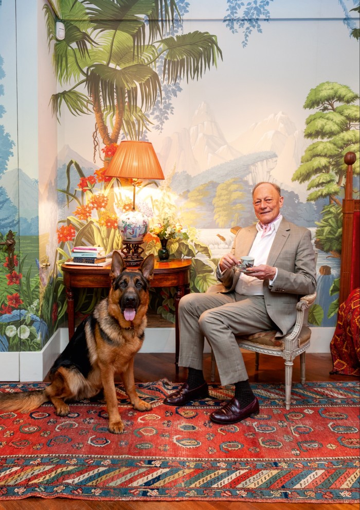 Claud Cecil Gurney with Mowgli, his German Shepherd, at home in London