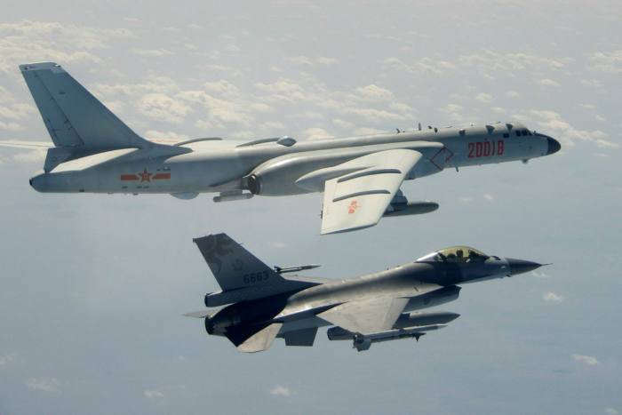 A Taiwanese Air Force F-16 in the foreground flies on the flank of a Chinese People’s Liberation Army Air Force H-6 bomber. China is flying record sorties of warplanes into Taiwan’s air defence identification zone