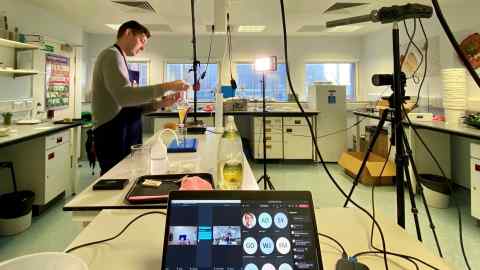 A Imperial College London lecturer is videoed conducting an experiment in the laboratory for his students to copy at home with their lab-in-a-box kits