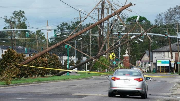 Crashed power lines in Metairie, Louisiana on Monday.  Utilities Entergy said it could take weeks for service to return to normal © AP