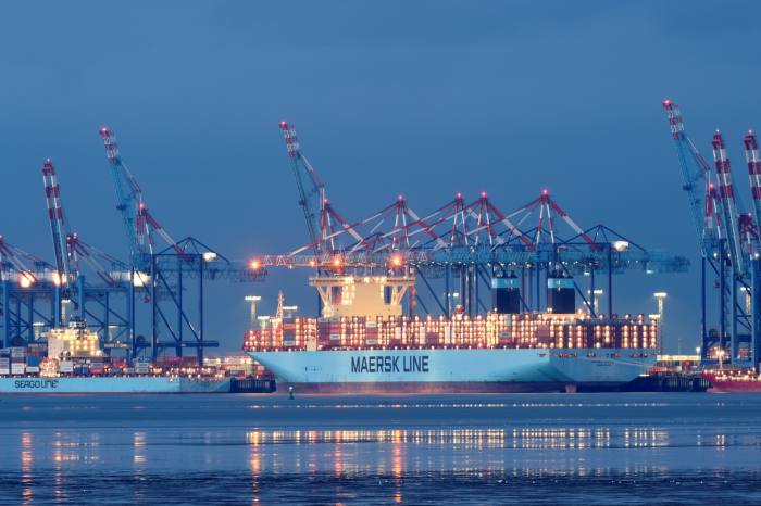 An AP Møller-Maersk container ship is loaded at a terminal in Bremerhaven, Germany