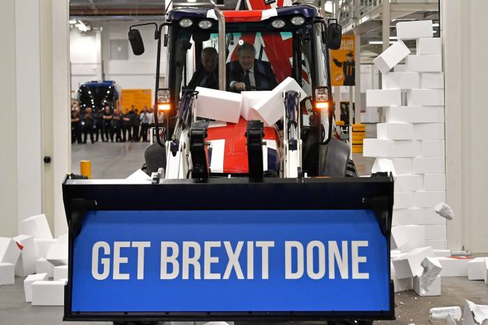 Boris Johnson drives a digger emblazoned with the slogan ‘Get Brexit Done’ during the 2019 general election campaign