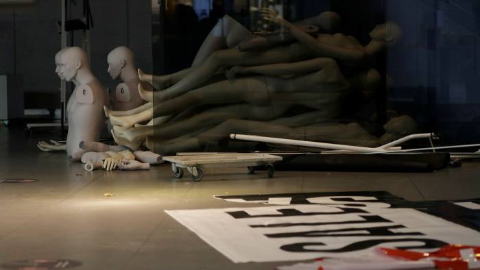 Mannequins left on the floor of a closed branch of Topshop on Oxford Street in London, England, on February 1 