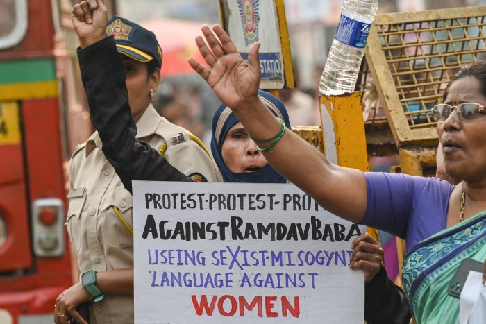 Activists shout slogans during a protest against self-proclaimed Indian yoga guru Baba Ramdev