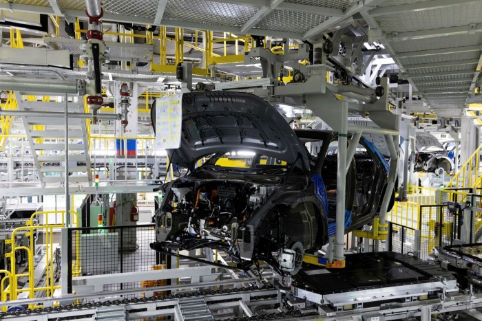 A conveyor moves a Hyundai Motor Co. Ioniq 5 electric vehicle,