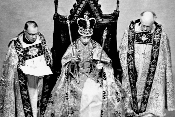 June 2 1953: Elizabeth II wears St Edward’s Crown and carries the sceptre and rod during her coronation in Westminster Abbey