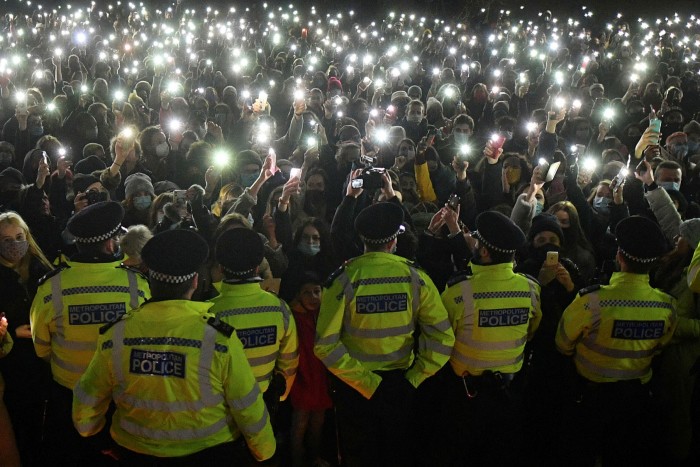 Well-wishers turn on their phone torches at a vigil in honour of murder victim Sarah Everard on Clapham Common, south London, in March