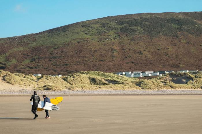 Sunny day surfers at Llangennith Beach, Rhossili Bay, Gower, Wales