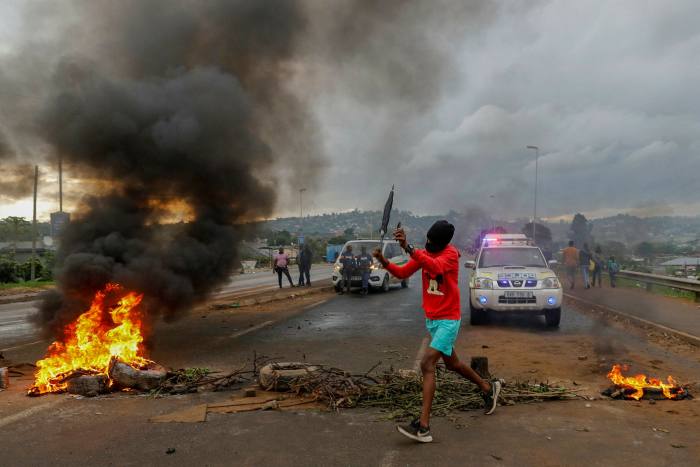 Residents of Bhambayi, a settlement north of Durban, protest over water and electricity services