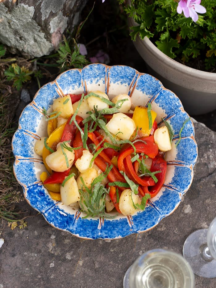 A serving dish of peach and pepper salad with cumin 