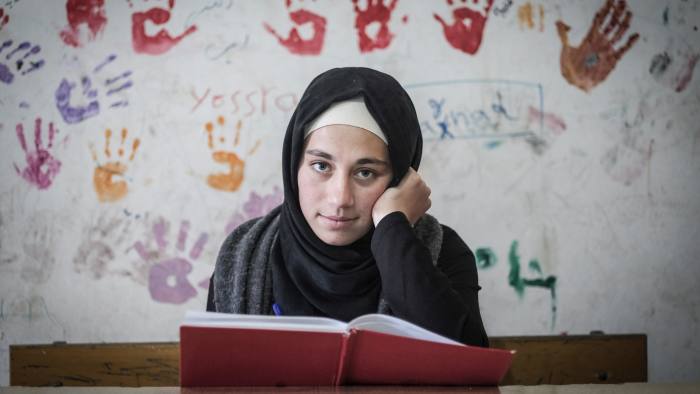 Catching up: Zeinab al Awad, a Syrian refugee, battled difficulties such as faltering internet access to achieve exam success