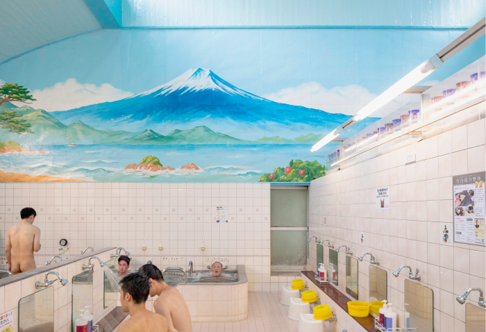 A mural of Mount Fuji on a wall over the communal bathing space at Daikoku-yu sento 