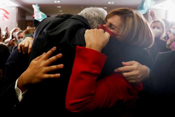 Costa is embraced by his wife Fernanda Tadeu in Lisbon, Portugal on Sunday after winning the general election 