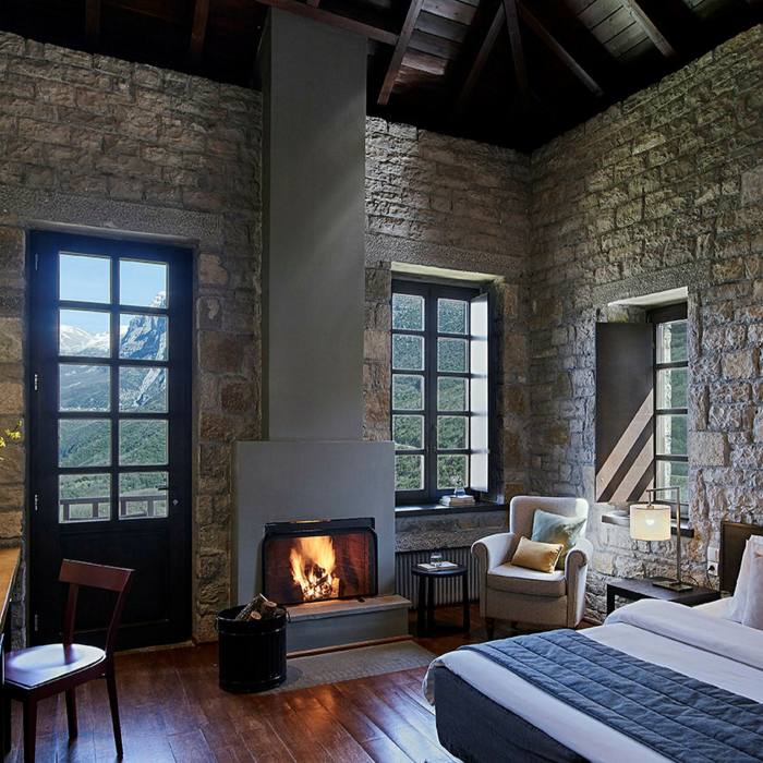 Aristi Mountain Resort offers a cosy welcome with wood-burning stoves or open hearths in traditional stone houses
