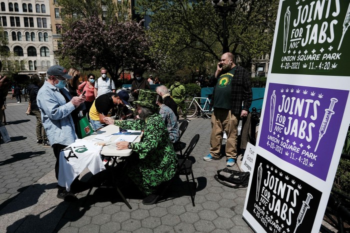 People line up for a free marijuana cigarette after showing proof of a Covid-19 vaccination at Union Square in New York last month