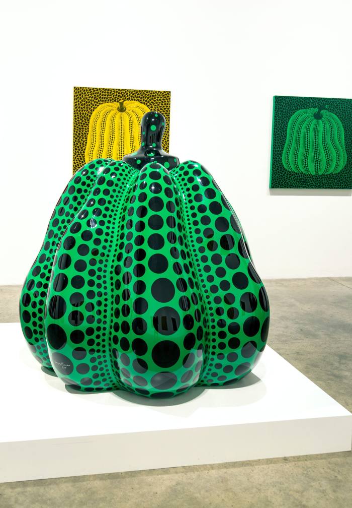 Green pumpkin with black dots sculpture by Yayoi Kusama