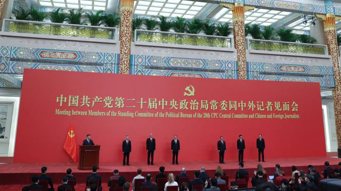 The seven members of China’s Politburo Standing Committee, all men, pose for media in Beijing