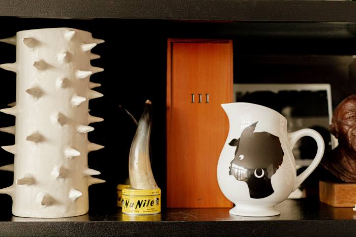 From left: ceramic vase by Paula Greif Ceramics in Hudson, NY; sculpture by Wangechi Mutu; Lorna Simpson’s III (Three Wishbones in a Wood Box), 1994; and a Kara Walker pitcher for Bernardaud